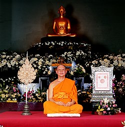 Luang Por Dhammajayo with honorific fan in Ubosoth